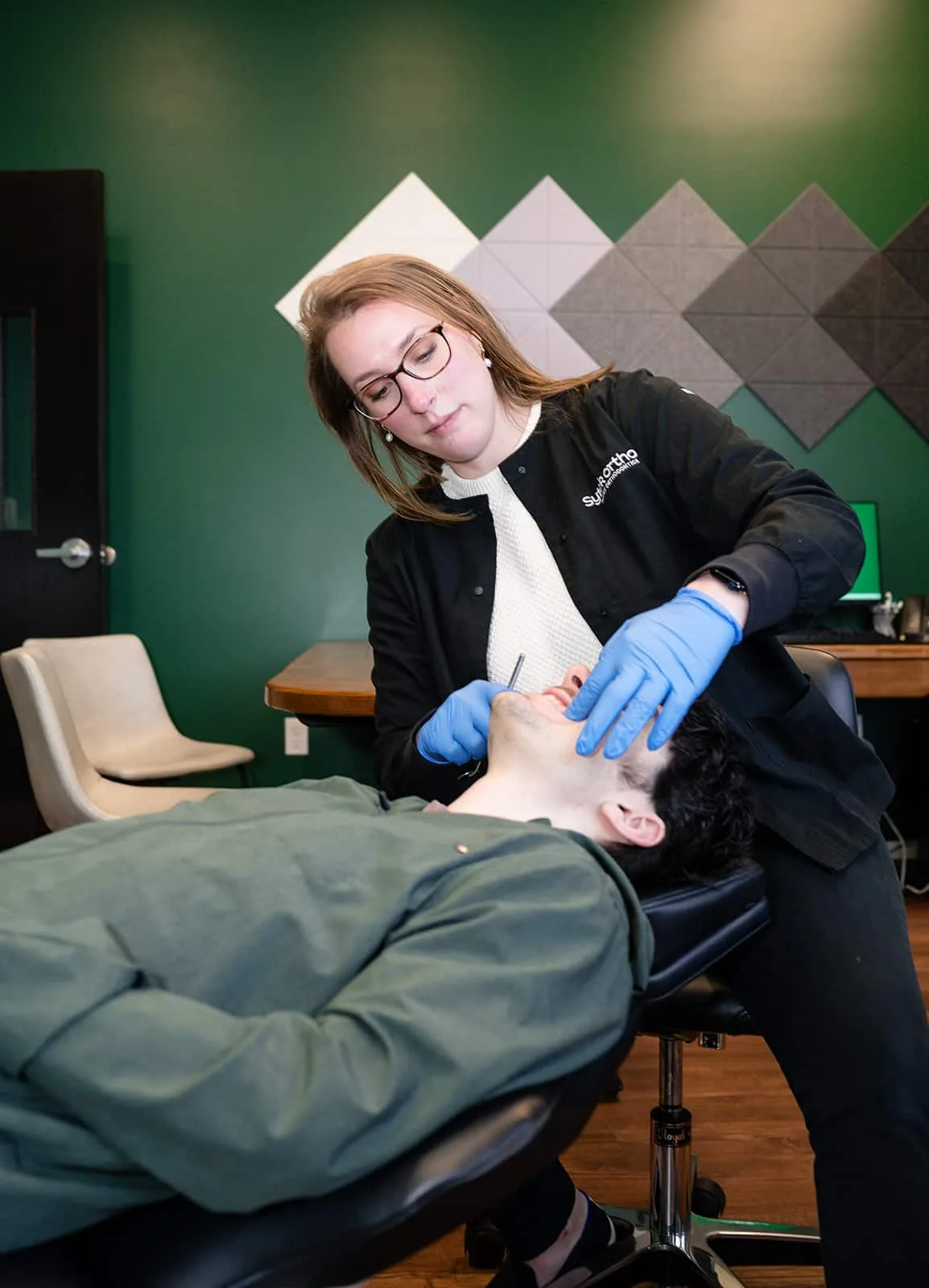 Dr. Lauren Sytek examining a patient at Sytek Ortho in Alpena, MI