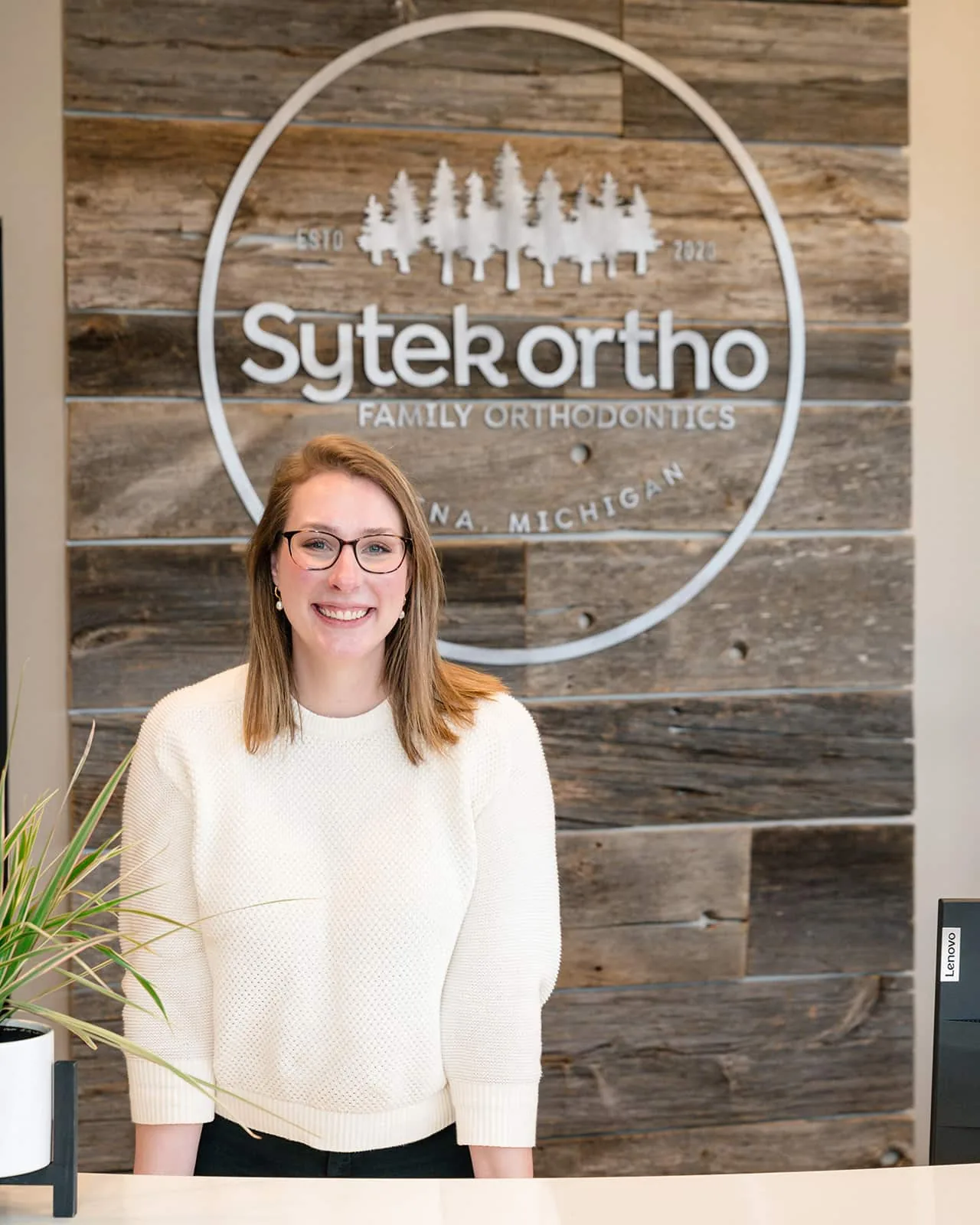 Dr. Lauren Sytek at the Sytek Ortho front desk in Alpena, MI