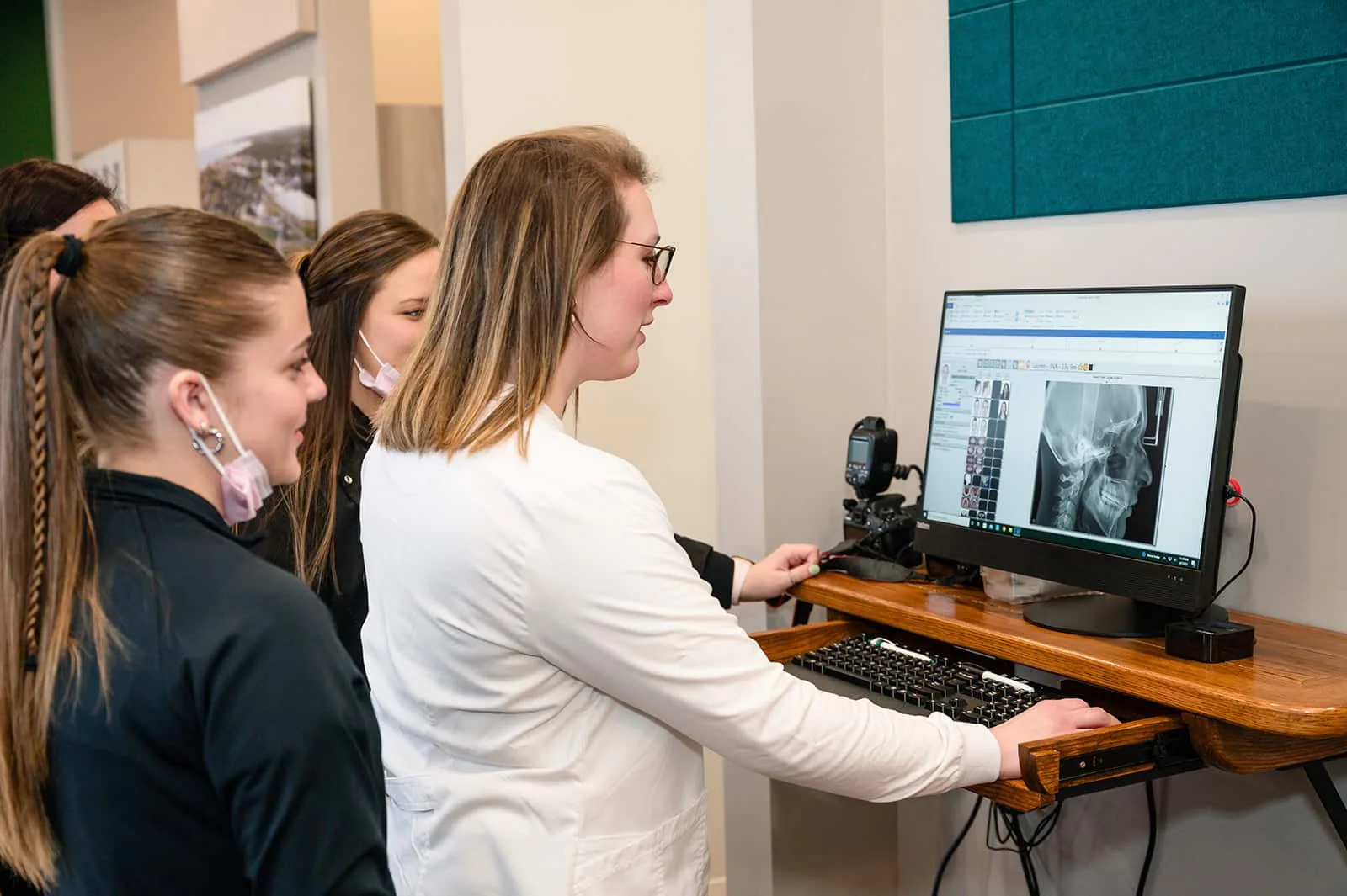 Dr. Lauren Sytek reviewing a cephalometric x-ray with staff at Sytek Ortho in Alpena, MI